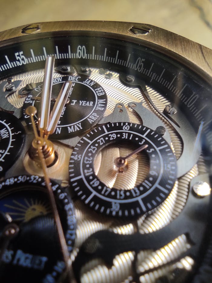 services-06 Close-up of a luxury watch's intricate mechanism, capturing detailed craftsmanship and elegance.